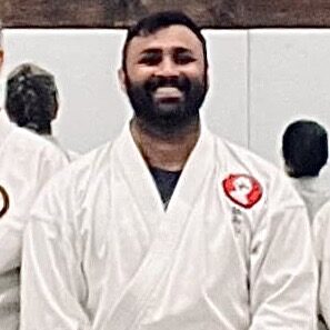 Sensei Krishan Narayan in a traditional white karate gi at Karate of LA