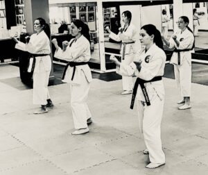 IMG_7956 A group of five women and girls practicing their karate kata