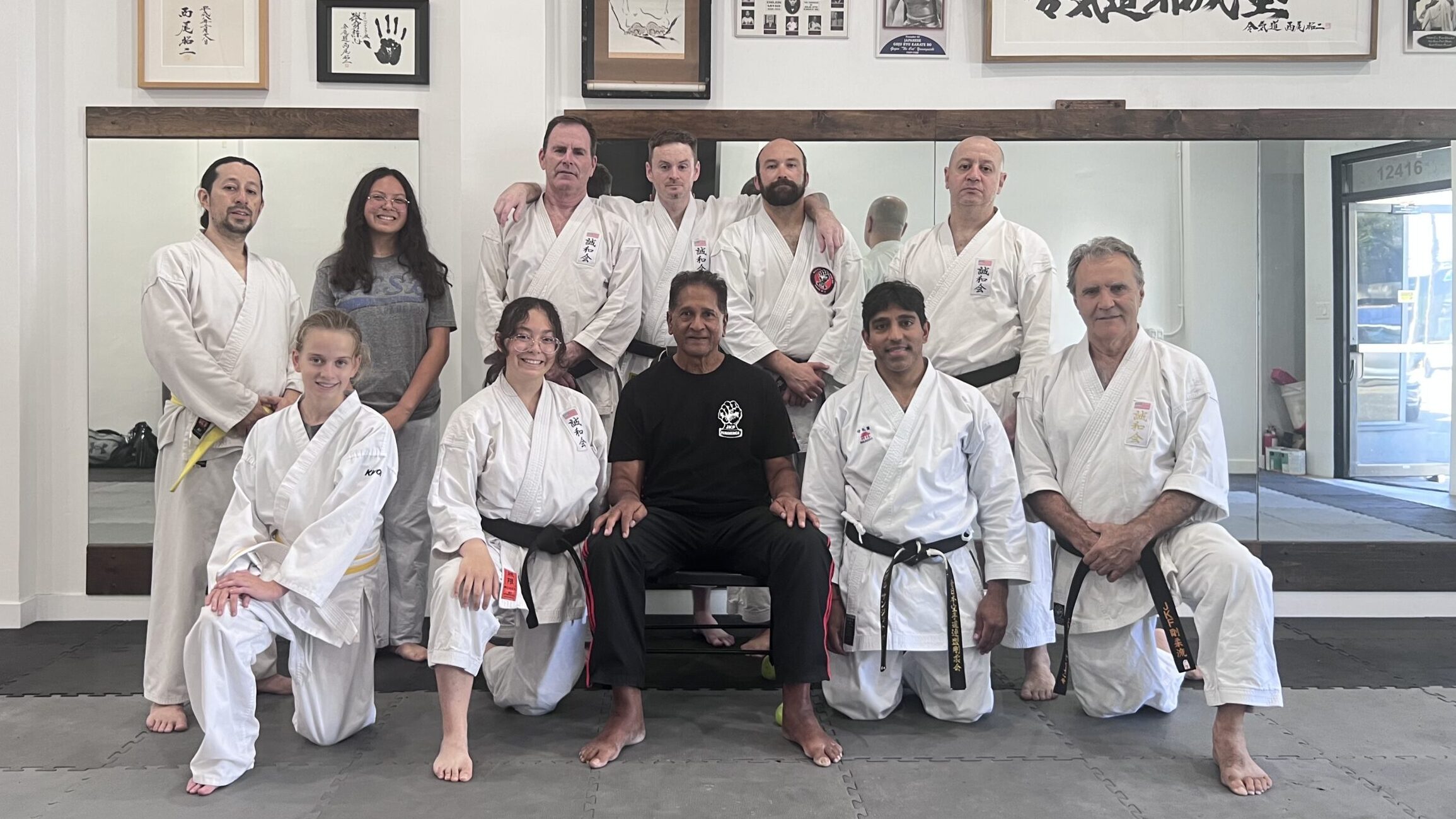 Adult martial arts students and instructors posing together on the mat during a Saturday Goju-Ryu training seminar at Karate of LA.