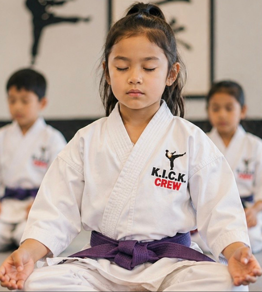Young karate students practicing mindfulness and focus during a Goju-Ryu class at Karate of LA.
