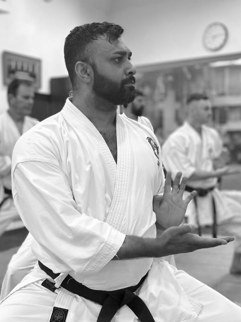 sensei-krishan-narayan-adult-karate-los-angeles Sensei Krishan Narayan demonstrating focused traditional Goju-Ryu karate technique during an adult class at Karate of LA.