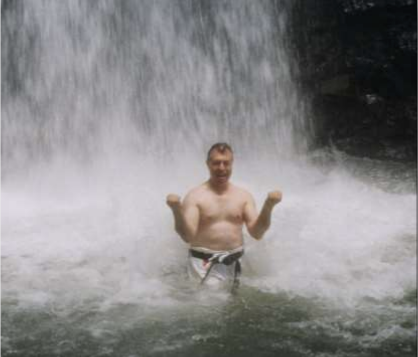 Seiwa-Kai Newsletter Issue 2 Cover Artwork - Photograph of a Karate Practitioner Performing a Kata Underneath a Waterfall